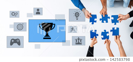 Collaborative Teamwork Symbolizing Success and Achievement with Puzzle Pieces and Trophy in Modern Business Environment Trope Collaborative Teamwork Symbolizing Success and Achievement with Puzzle Pieces and Trophy in Modern Business Environment Trope 142583798