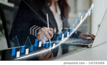 Business professional analyzing financial data with glowing graph on laptop, showcasing growth trends and positive performance in modern office setting Copula Business professional analyzing financial data with glowing graph on laptop, showcasing growth trends and positive performance in modern office setting Copula 142583888