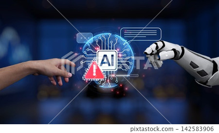 Human hand and robotic hand reaching towards a digital AI symbol with alert signs, representing collaboration between technology and humanity in a modern workspace Synapse 142583906