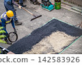 Asphalt paving, paving work, asphalt mixture spreading and leveling, hydraulic excavator, backhoe, paving rake, surface work. 142583926