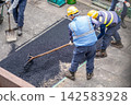 Asphalt paving, paving work, asphalt mixture spreading and leveling, paving rake, surface work, surface finishing with a sieve to ensure uniform particle size. 142583928