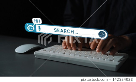 Hands typing on keyboard with search bar and microphone icon indicating voice command technology in modern digital workspace. Entropy Hands typing on keyboard with search bar and microphone icon indicating voice command technology in modern digital workspace. Entropy 142584028