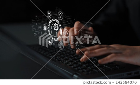Hands typing on a laptop keyboard with futuristic digital interface displaying technology concepts and icons related to artificial intelligence and data analysis. Entropy Hands typing on a laptop keyboard with futuristic digital interface displaying technology concepts and icons related to artificial intelligence and data analysis. Entropy 142584070