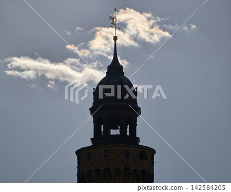 Nighttime tower with glowing outline. Silhouette of bellshaped tower outline in evening light contrast Nighttime tower with glowing outline. Silhouette of bellshaped tower outline in evening light contrast 142584205