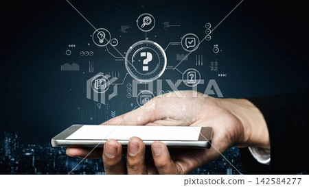 Hand holding smartphone with digital interface displaying question marks and various icons representing innovation, technology, data analysis, and communication concepts. Entropy Hand holding smartphone with digital interface displaying question marks and various icons representing innovation, technology, data analysis, and communication concepts. Entropy 142584277