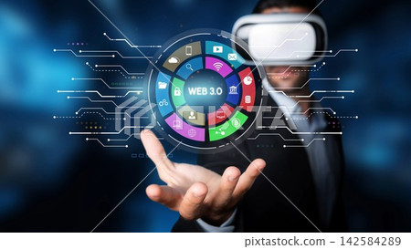 Businessman in Virtual Reality Headset Engaging with Digital Interface Representing Web 3.0 Concepts in Modern Technology Environment. Entropy Businessman in Virtual Reality Headset Engaging with Digital Interface Representing Web 3.0 Concepts in Modern Technology Environment. Entropy 142584289