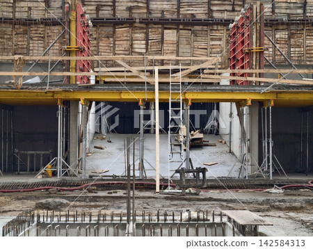 Interior staircase structure underway. Construction of stairwell core in progress with temporary supports Interior staircase structure underway. Construction of stairwell core in progress with temporary supports 142584313