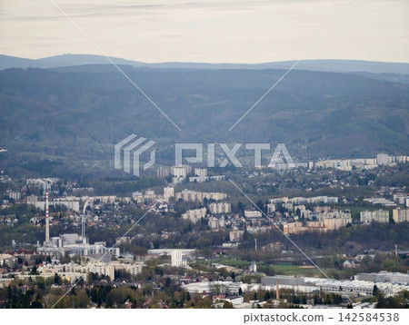Urban nature landscape. Transport routes traverse scenic valleys with sustainability and green spaces Urban nature landscape. Transport routes traverse scenic valleys with sustainability and green spaces 142584538