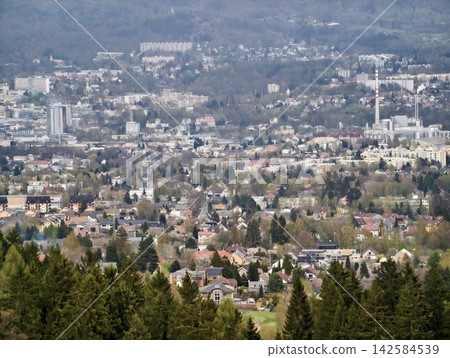 Countryside nestled among lush hills. Hamlet on edge of nature with vibrant flora and rolling hills Countryside nestled among lush hills. Hamlet on edge of nature with vibrant flora and rolling hills 142584539
