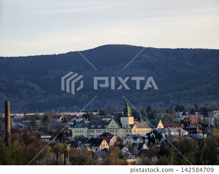 Picturesque pastoral community nestled on hill with lush landscapes and serene surroundings Picturesque pastoral community nestled on hill with lush landscapes and serene surroundings 142584709
