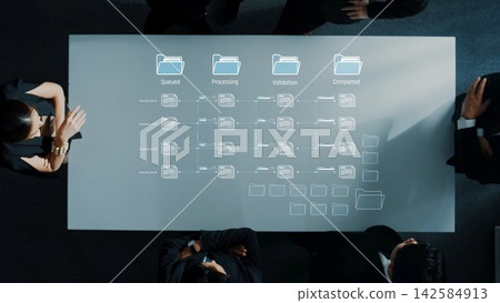 Business team collaborating on data management process with digital workflow diagram on modern table showcasing project stages and organization strategy.. Raster Business team collaborating on data management process with digital workflow diagram on modern table showcasing project stages and organization strategy.. Raster 142584913
