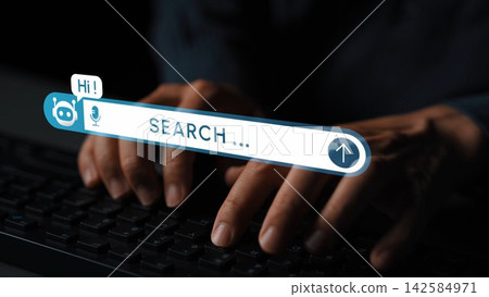 Close-up view of hands actively typing on a keyboard with a dynamic digital search bar and virtual assistant icon, set against a moody dark background, showmodern technology interaction. Entropy Close-up view of hands actively typing on a keyboard with a dynamic digital search bar and virtual assistant icon, set against a moody dark background, showmodern technology interaction. Entropy 142584971