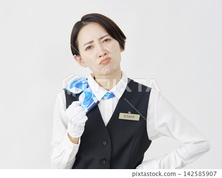 Female staff member, receptionist/bus guide, angry, white background. Female staff member, receptionist/bus guide, angry, white background. 142585907