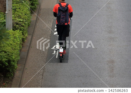 Image of an electric kickboard running on the road Image of an electric kickboard running on the road 142586263