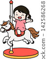 A girl riding a merry-go-round 142586268