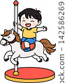 A boy riding a merry-go-round 142586269