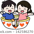 A child riding a coffee cup 142586270