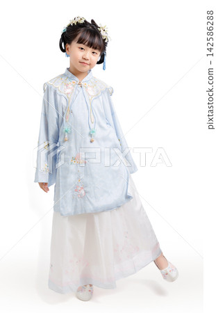 Full length profile of a young girl wearing a traditional light blue Hanfu dress standing against a seamless white background. Full length profile of a young girl wearing a traditional light blue Hanfu dress standing against a seamless white background. 142586288