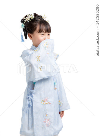 Medium shot of an innocent girl in ancient Chinese attire looking down thoughtfully during a studio photoshoot. Medium shot of an innocent girl in ancient Chinese attire looking down thoughtfully during a studio photoshoot. 142586290