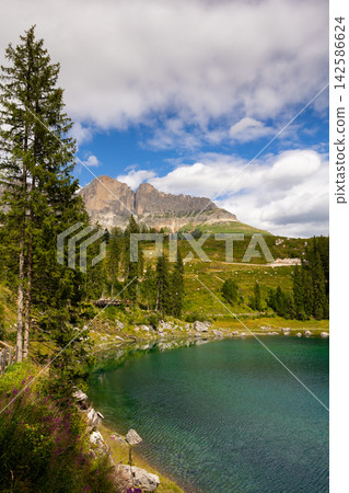 Lake landscape with mountain and forest, Lago di Carezza, Italy Lake landscape with mountain and forest, Lago di Carezza, Italy 142586624