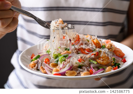 Thai spicy glass noodle salad with minced pork and shrimp (Yum Woon Sen) Thai spicy glass noodle salad with minced pork and shrimp (Yum Woon Sen) 142586775
