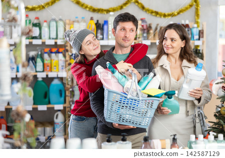 Happy family shopping for cleaning products and toiletries in festive store Happy family shopping for cleaning products and toiletries in festive store 142587129