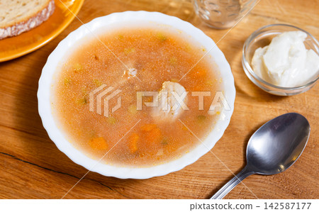 Rassolnik with sour pickles and pearl barley Rassolnik with sour pickles and pearl barley 142587177