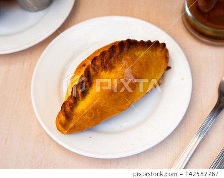 Empanada pie stuffed with meat and vegetables Empanada pie stuffed with meat and vegetables 142587762