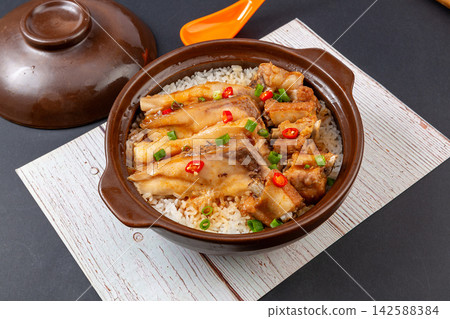 Chinese combo claypot rice with tender fish belly and savory pork ribs, Cantonese baozaifan Chinese combo claypot rice with tender fish belly and savory pork ribs, Cantonese baozaifan 142588384
