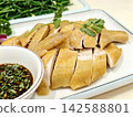 ```The delicately plated white cut chicken served with dipping sauce``` 142588801