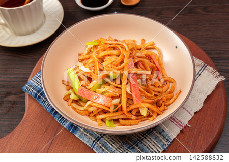 chinese Stir-Fried Shredded Pancake Noodles with Sliced Ham, Savory Asian Street Food chinese Stir-Fried Shredded Pancake Noodles with Sliced Ham, Savory Asian Street Food 142588832