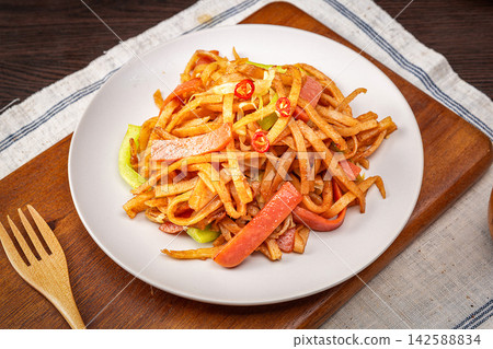 chinese Stir-Fried Shredded Pancake Noodles with Sliced Ham, Savory Asian Street Food 142588834