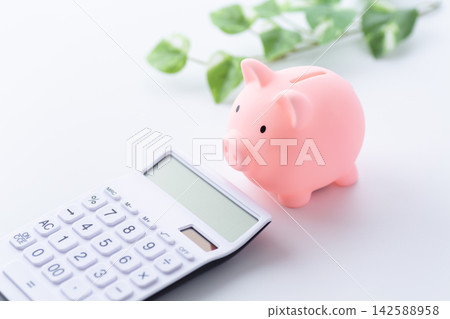 Pink pig's piggy bank and calculator Pink pig's piggy bank and calculator 142588958