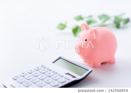 Pink pig's piggy bank and calculator Pink pig's piggy bank and calculator 142588959