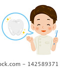 An illustration of the upper body of a smiling male dentist holding a toothbrush. 142589371