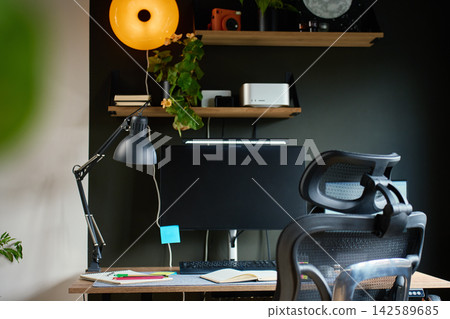 Home office workspace with desk and ergonomic chair Home office workspace with desk and ergonomic chair 142589685