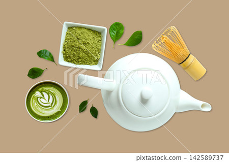 Matcha. Matcha powder, whisk, and tea leaves arranged for preparation Matcha. Matcha powder, whisk, and tea leaves arranged for preparation 142589737