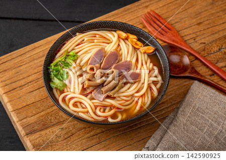 spicy Rice Noodles with Braised Duck Offal, Traditional Chinese Mifen Soup in Ceramic Bowl 142590925