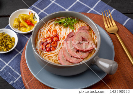traditional Chinese Rice Noodle Soup with Sliced Pork Heart, Spicy Mifen Bowl with Peanuts traditional Chinese Rice Noodle Soup with Sliced Pork Heart, Spicy Mifen Bowl with Peanuts 142590933