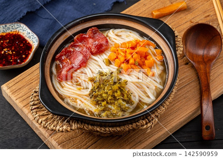 spicy Chinese Rice Noodle Soup with Sliced Sweet Chinese Sausage, Traditional Mifen Noodle Bowl spicy Chinese Rice Noodle Soup with Sliced Sweet Chinese Sausage, Traditional Mifen Noodle Bowl 142590959