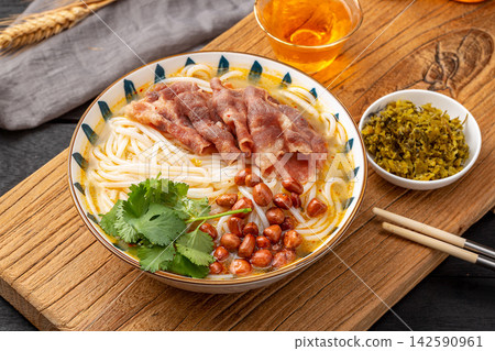 chinese Rice Noodles with Fatty Beef Slices in Golden Sour and Spicy Broth, Yunnan Mixian Bowl chinese Rice Noodles with Fatty Beef Slices in Golden Sour and Spicy Broth, Yunnan Mixian Bowl 142590961