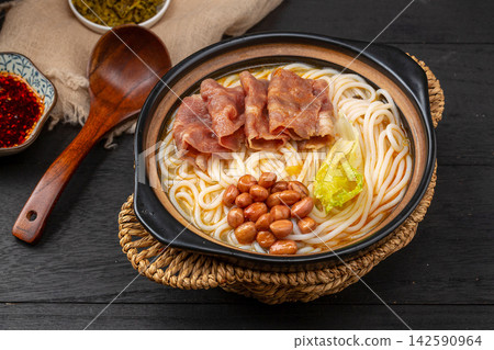chinese Rice Noodles with Fatty Beef Slices in Golden Sour and Spicy Broth, Yunnan Mixian Bowl chinese Rice Noodles with Fatty Beef Slices in Golden Sour and Spicy Broth, Yunnan Mixian Bowl 142590964