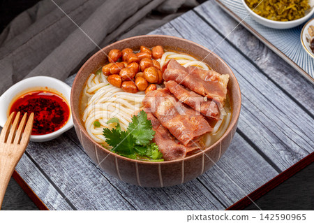 chinese Rice Noodles with Fatty Beef Slices in Golden Sour and Spicy Broth, Yunnan Mixian Bowl chinese Rice Noodles with Fatty Beef Slices in Golden Sour and Spicy Broth, Yunnan Mixian Bowl 142590965