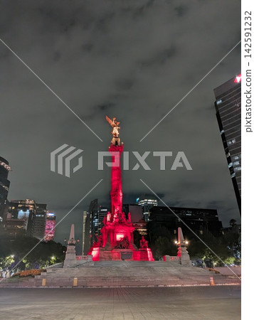 Mexico City: El Ángel, the Independence Monument, illuminated in red at night, and the skyscrapers of Reforma Avenue. Mexico City: El Ángel, the Independence Monument, illuminated in red at night, and the skyscrapers of Reforma Avenue. 142591232