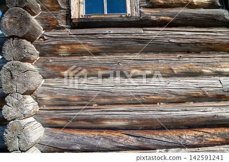 Corner of Wooden Log Cabin with Notched Joint, Close-Up Corner of Wooden Log Cabin with Notched Joint, Close-Up 142591241