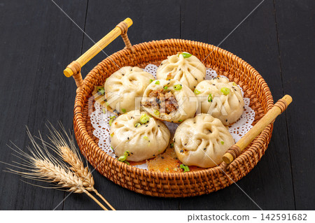 pan fried pork and shiitake mushroom buns with lacy skirt, Chinese shengjian baozi street food pan fried pork and shiitake mushroom buns with lacy skirt, Chinese shengjian baozi street food 142591682