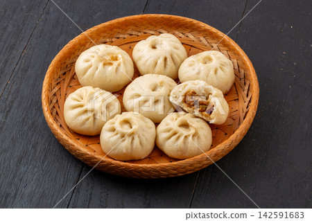 steamed pork and shiitake mushroom xiaolongbao soup dumplings in bamboo steamer, Chinese dim sum steamed pork and shiitake mushroom xiaolongbao soup dumplings in bamboo steamer, Chinese dim sum 142591683