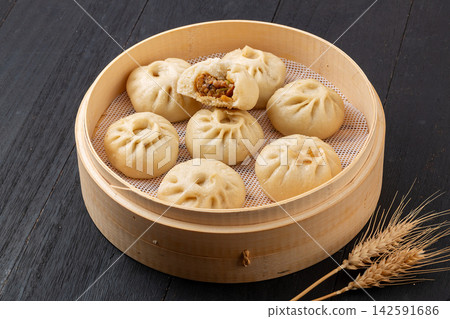 steamed pork and shiitake mushroom xiaolongbao soup dumplings in bamboo steamer, Chinese dim sum steamed pork and shiitake mushroom xiaolongbao soup dumplings in bamboo steamer, Chinese dim sum 142591686