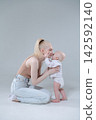 Young Mother and Baby Boy Touching Noses, Tender Moment 142592140