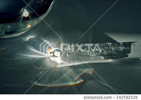 Pipette drawing cosmetic serum with light refractions Pipette drawing cosmetic serum with light refractions 142592526